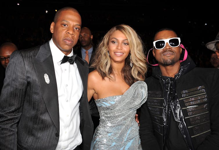 Three celebrities attend an event.