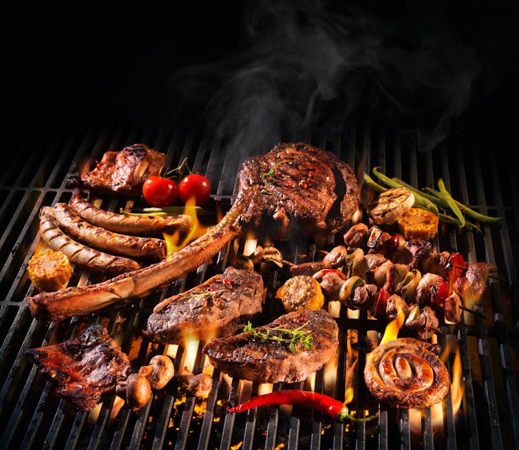 A variety of meats on a barbecue grill