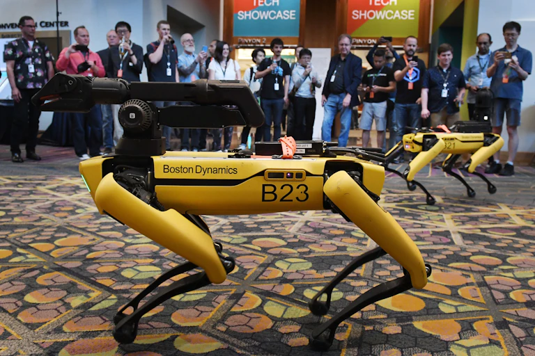 Boston Dynamics robot dog with people looking at it