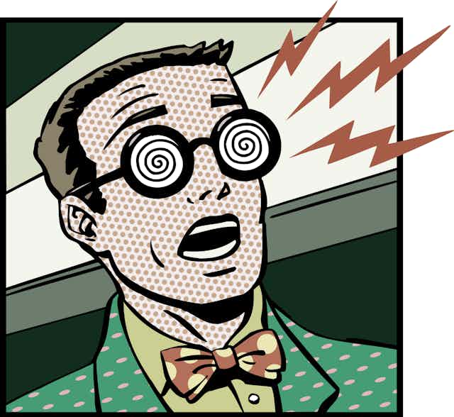 cartoon image of a man with short hair, wearing a bow tie and glasses with spiral patterns on the lenses, his mouth open in shock