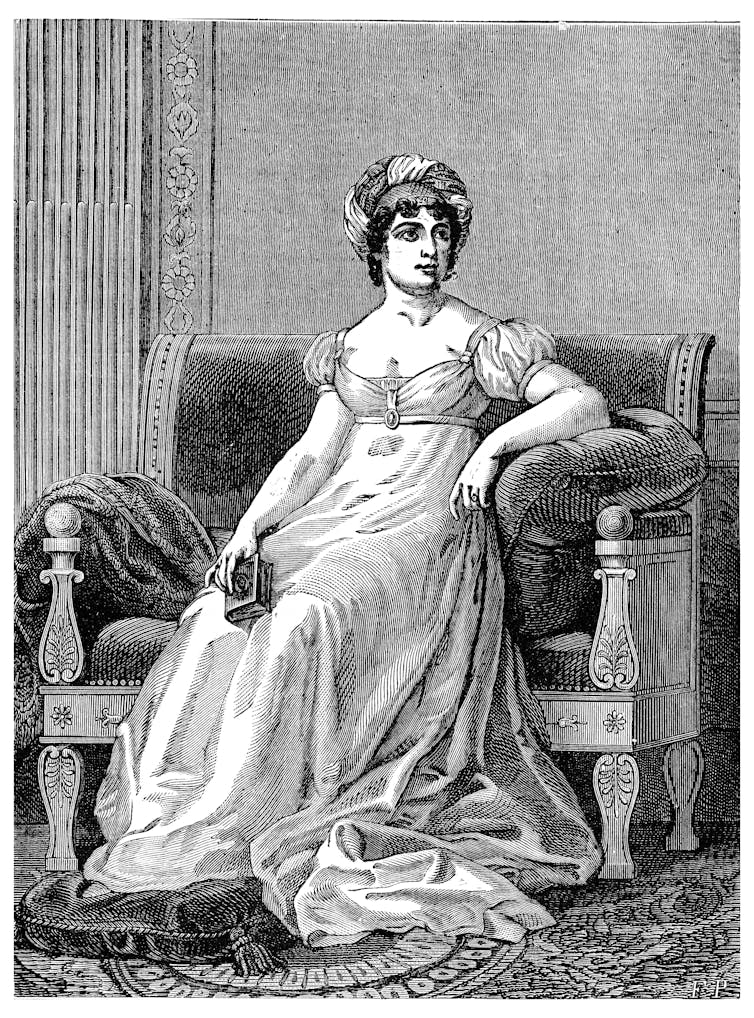 Black and white illustration of Germaine de Staël in a dress sitting on a large chair