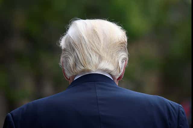 The back of Donald Trump's head and shoulders