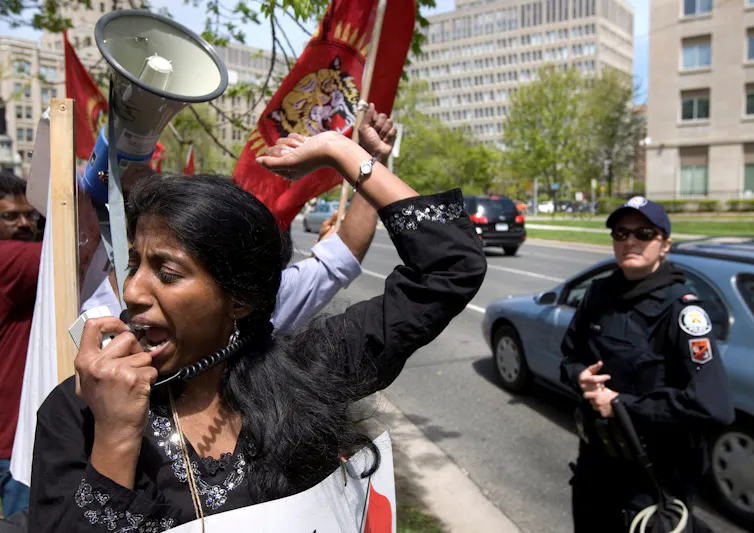 Woman shouts into megaphone