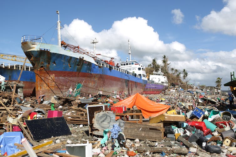 Beached vessels surrounded by devastation.