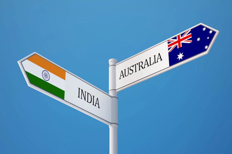 A sign, in one direction pointing to India, and in the other, Australia