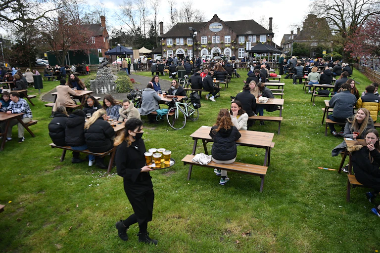 Customers at the Fox on the Hill pub in south London, Britain