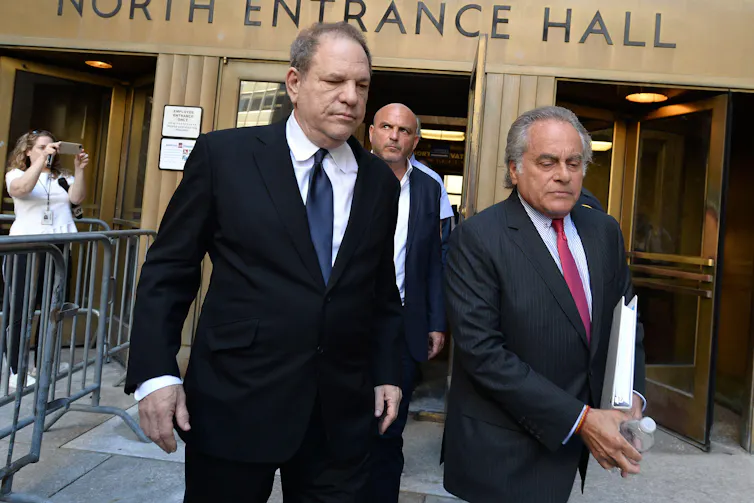 Harvey Weinstein walking out of New York Supreme Court with his lawyer Benjamin Brafman.