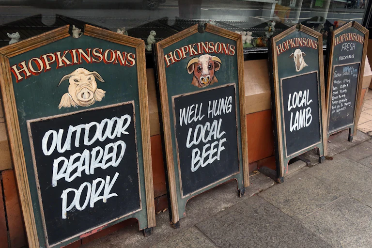 Butchers signs: local lamb, local beef, outdoor pork