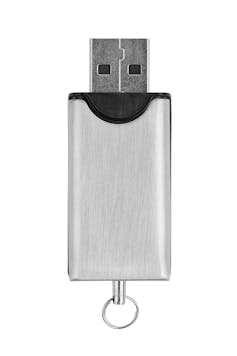 silver and black USB thumb drive facing upwards