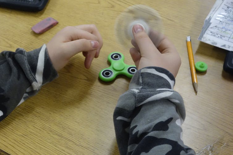 Popping toys, the latest fidget craze, might reduce stress for adults and children alike