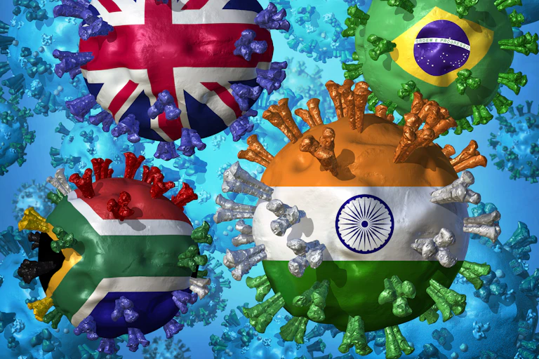 Ilustración de cuatro virus con banderas de UK, Brasil, India y Sudáfrica.