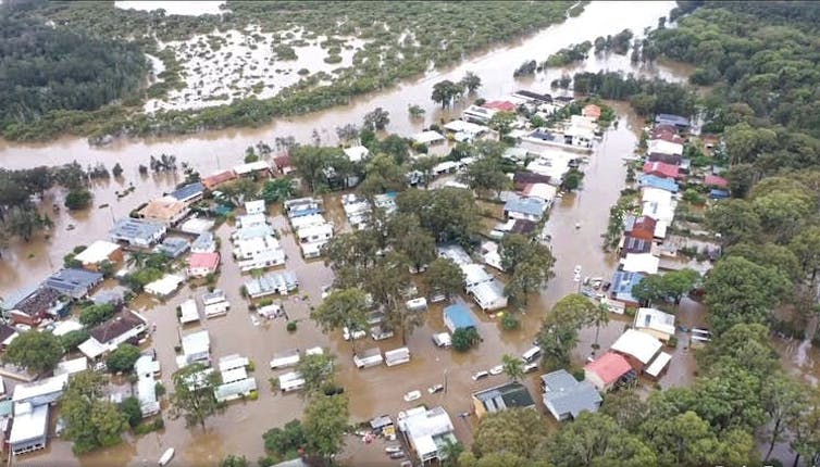 aerial view of flooded caravans, cabins and houses