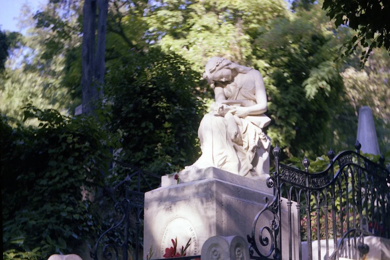 statue of woman in cemetary
