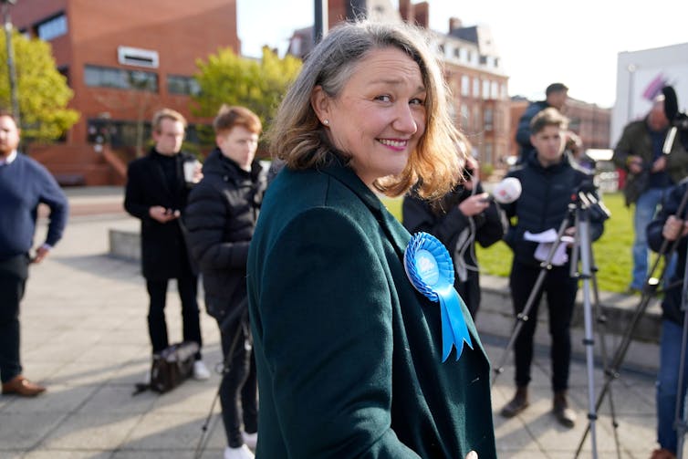 Conservative MP Jill Mortimer in front of a line of press photographers.