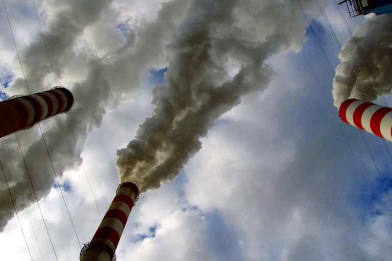 Smoke coming out of chimneys.