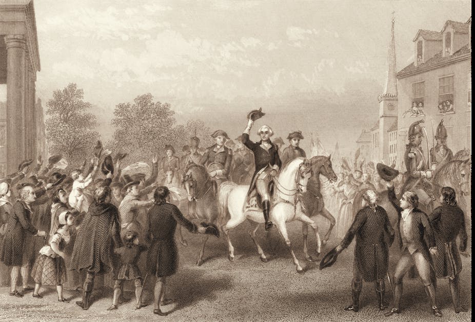 George Washington on horseback doffing his hat in a crowd.