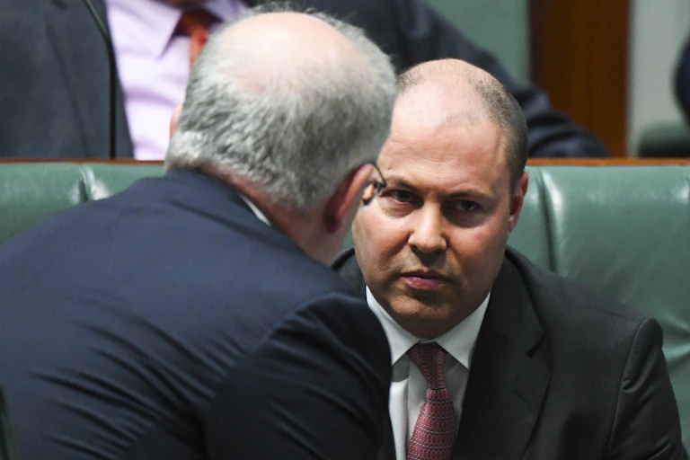Scott Morrison talking to Josh Frydenberg during question time