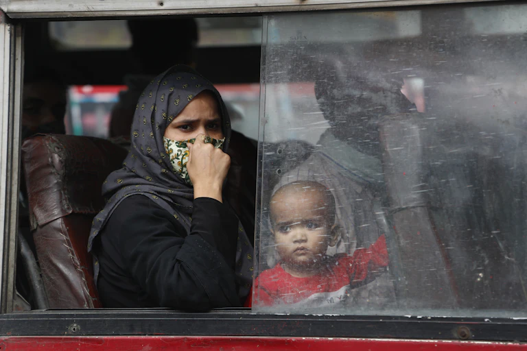 An Indian mother and her infant on a bus in New Delhi.