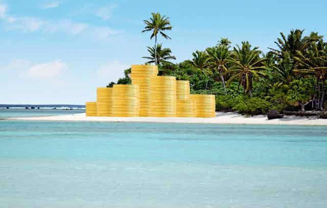 Illustration of piles of giant gold coins on a tropical beach. 