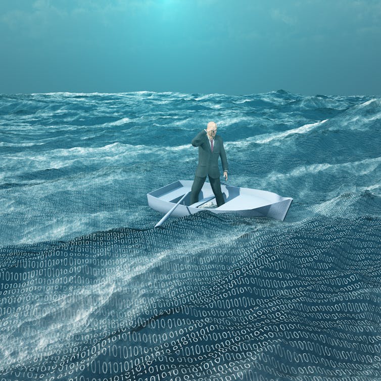 A man in a suit standing in a rowboat on a sea filled with binary symbols.