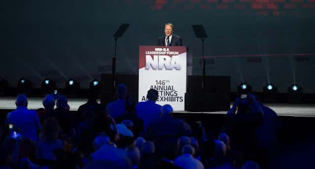 NRA leader Wayne LaPierre, at a podium