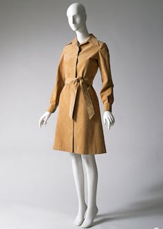 A mannequin dressed in a tan Halston shirtdress.
