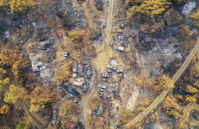 An aerial view of burned structures and cars after the Creek Fire near Shaver Lake, California