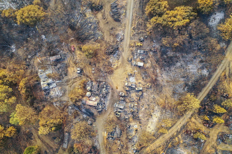 An aerial view of burned structures and cars after the Creek Fire near Shaver Lake, California