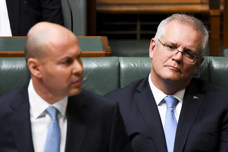 Scott Morrison watching Josh Frydenberg deliver the budget