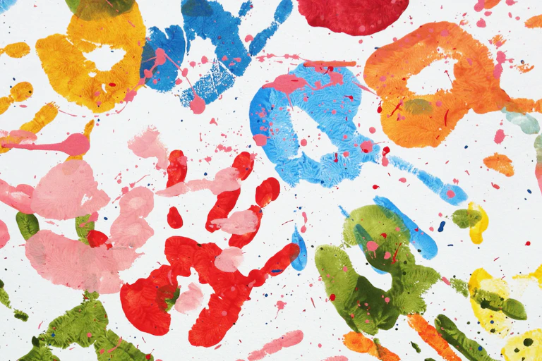 Handprints in paint on a paper.