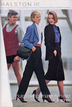 A man looks at two stylishly dressed women walking by.
