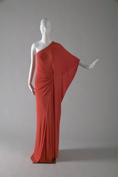 A red dress on a mannequin.