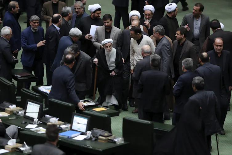 Ayatollah Ahmad Jannati is seen in a crowd of people