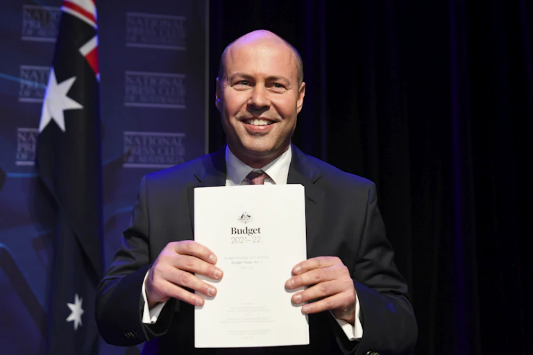 Josh Frydenberg holding the 2021-22 budget