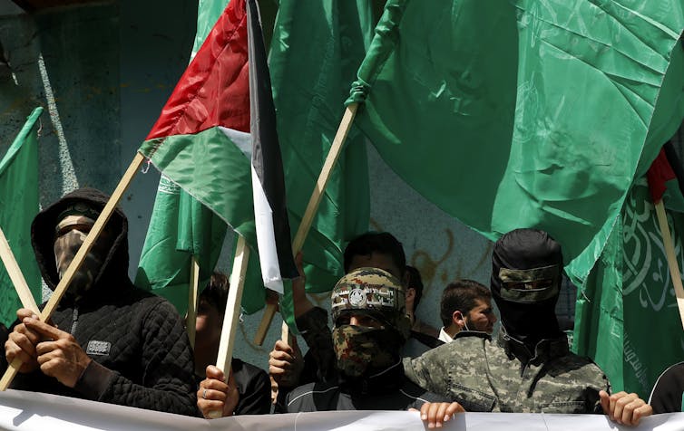 Hamas militants protesting against Abbas.