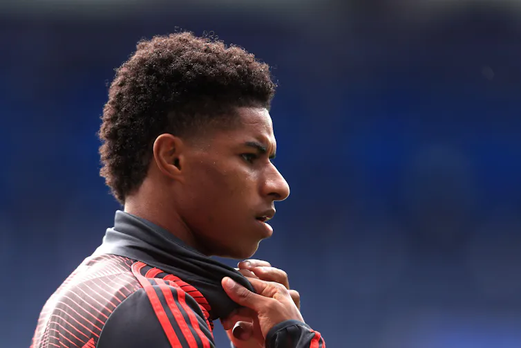 A close-up profile shot of Man U striker Marcus Rashford in training kit