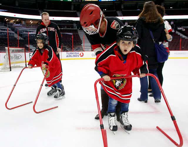 Young refugee children learn to skate.