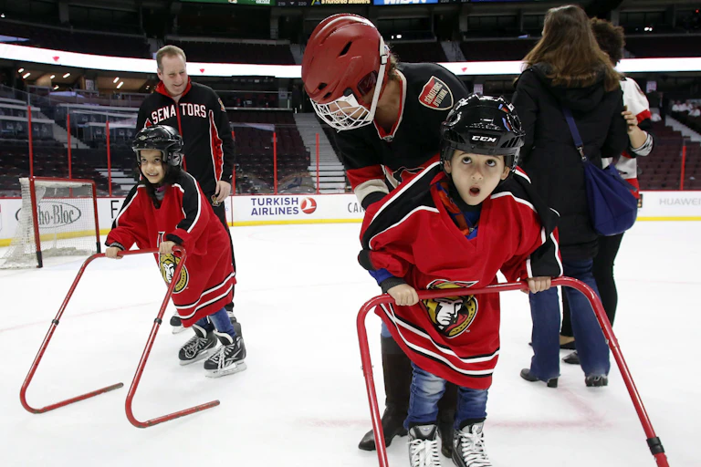 Young refugee children learn to skate.