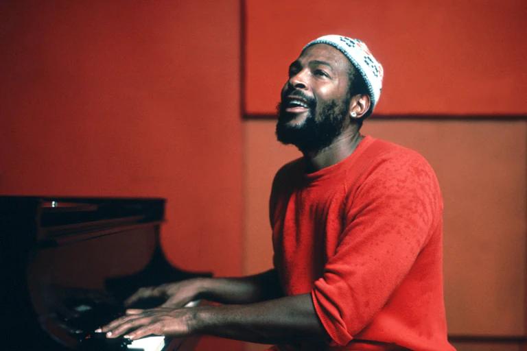 Marvin Gaye sitting at the piano.
