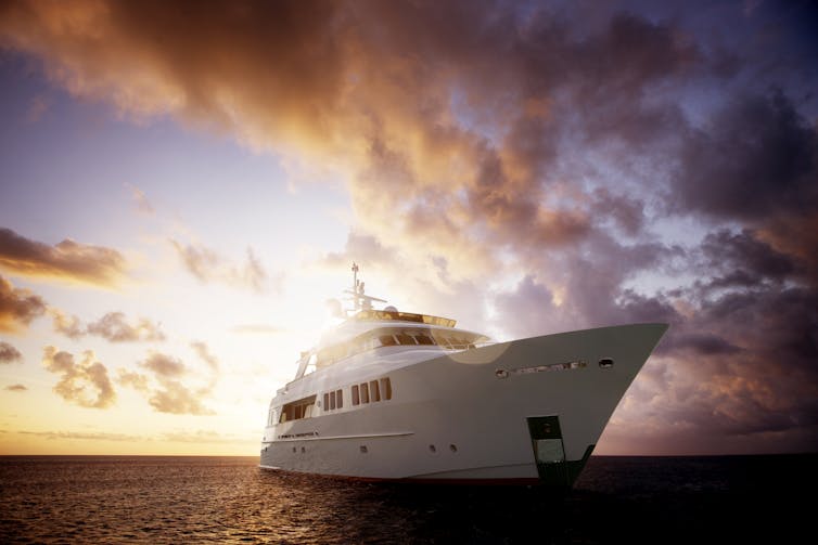 A yacht against a beautiful sunset