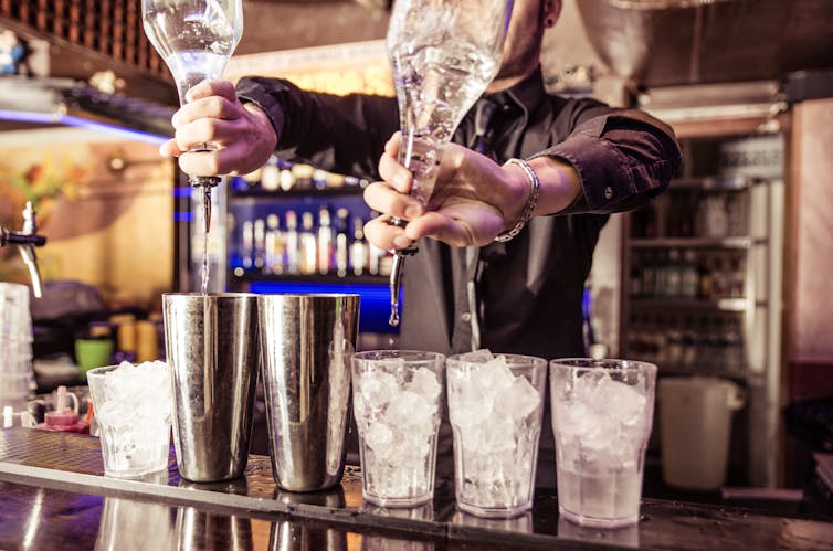 Bartender pouring drinks