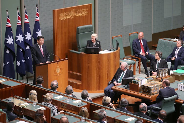 Chinese. man speaks to Australian parliament