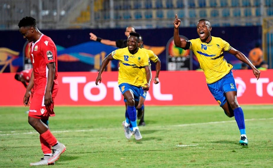 A Tanzanian player celebrates a goal against Kenya