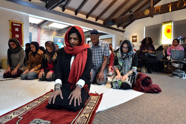 A Muslim woman leads prayers inside the Qal'bu Maryam women's mosque in Berkeley, California.