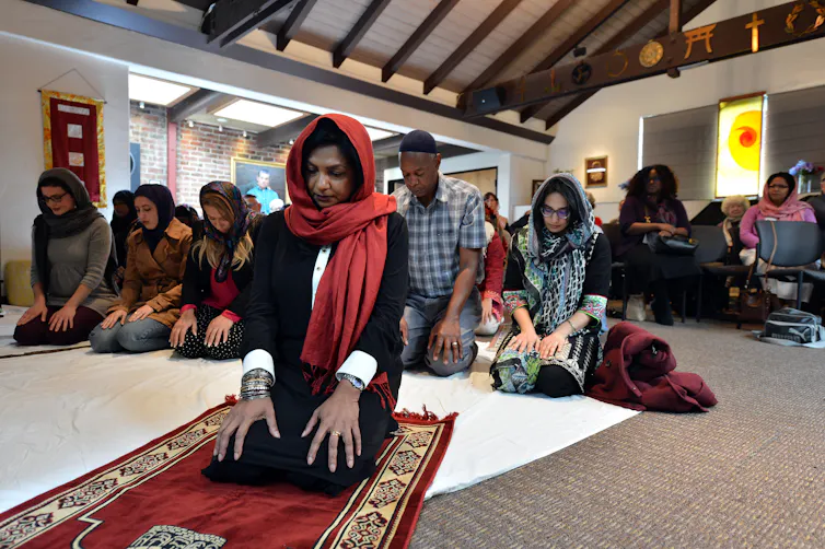 A Muslim woman leads prayers inside the Qal'bu Maryam women's mosque in Berkeley, California.