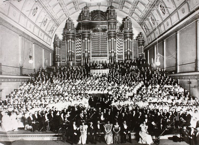 A big crowd in evening wear.