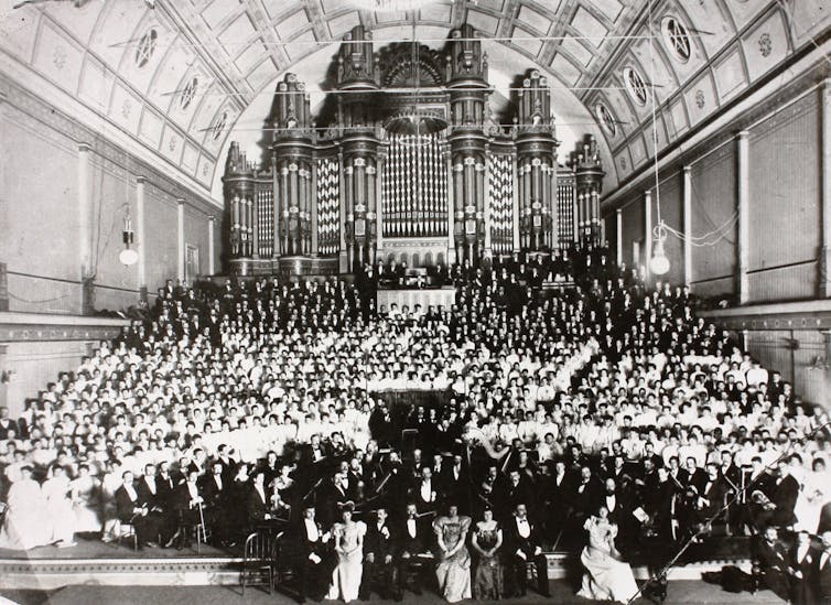 A big crowd in evening wear.