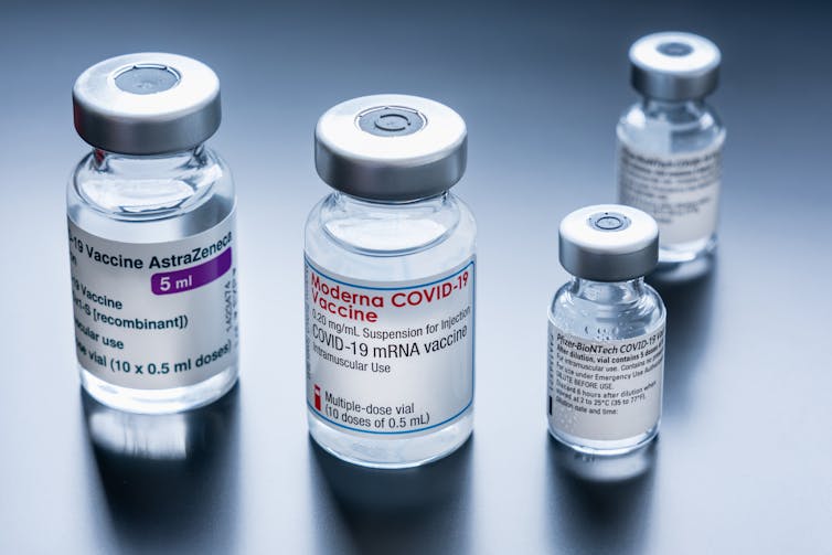 Vials of the AstraZeneca, Pfizer and Moderna COVID-19 vaccines