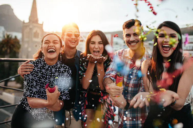 A group of friends smiling at the camera.