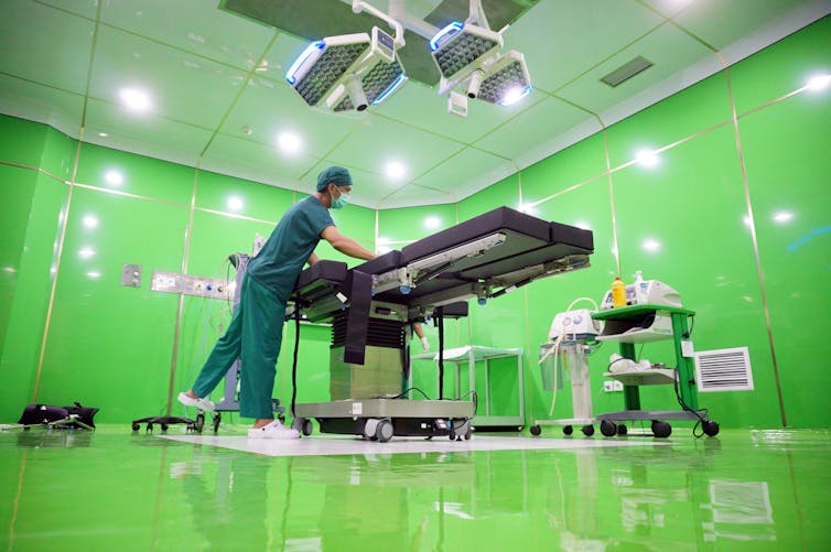 A health worker prepares an operating room for COVID-19 patients in a hospital in Tulungagung, East Java.